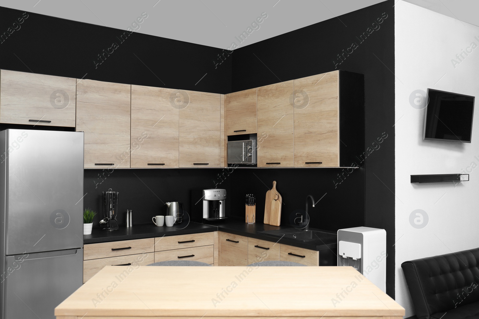 Photo of Cozy modern kitchen interior with new furniture and appliances