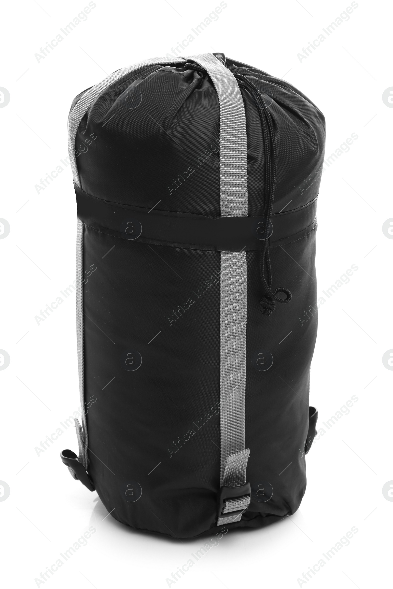 Photo of Sleeping bag in case on white background. Camping equipment