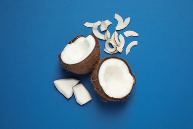 Flat lay composition with tasty coconut chips on blue background