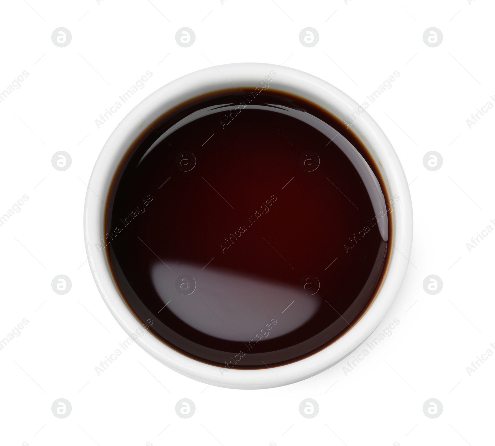 Photo of Tasty soy sauce in bowl isolated on white, top view