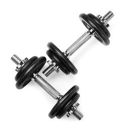 Metal dumbbells isolated on white, top view. Sports equipment