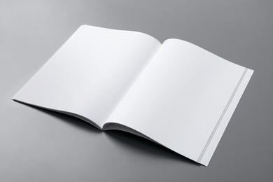 Photo of Empty book pages on grey background. Mockup for design