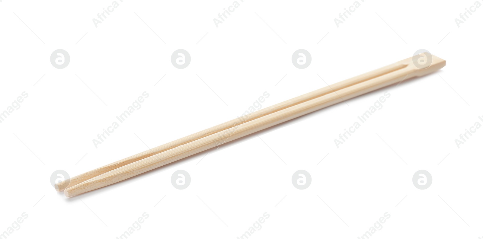 Photo of Chopsticks made of bamboo on white background