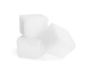 Photo of Three refined sugar cubes isolated on white