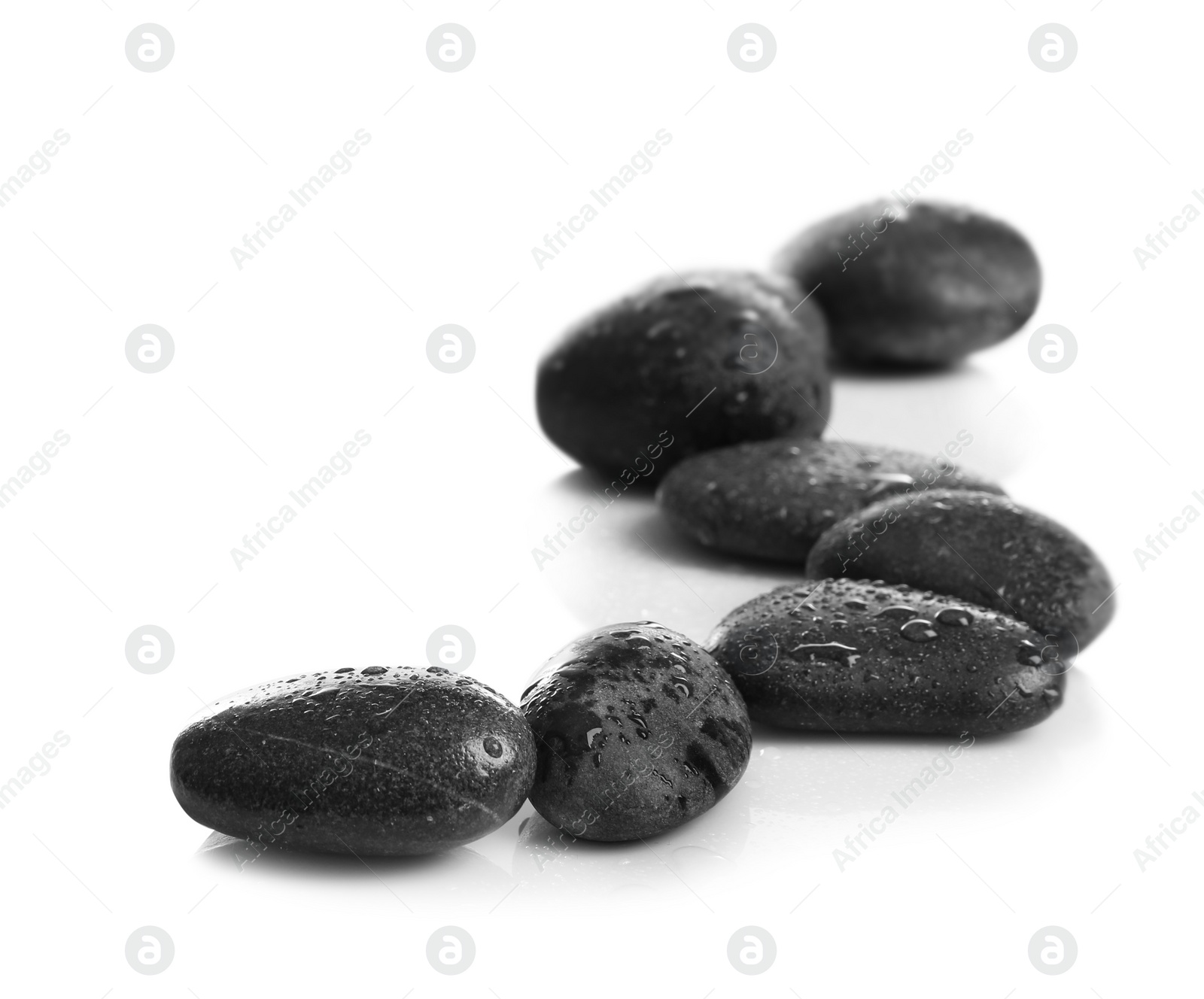 Photo of Composition with wet spa stones on white background