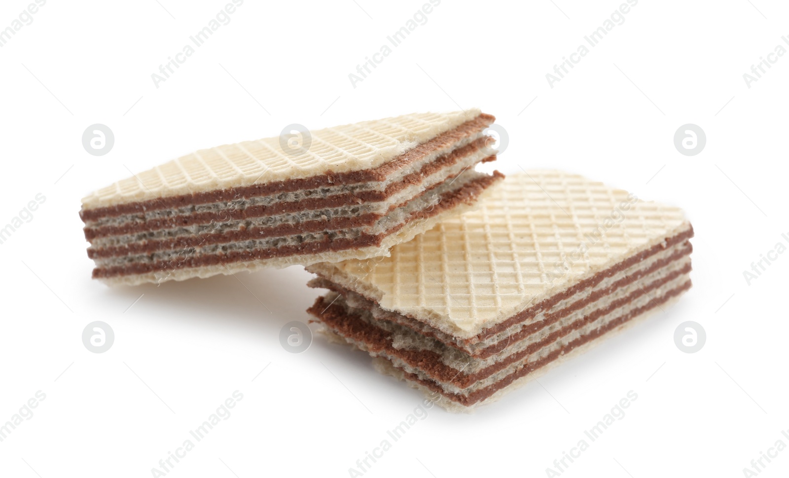 Photo of Delicious broken crispy wafer on white background. Sweet food