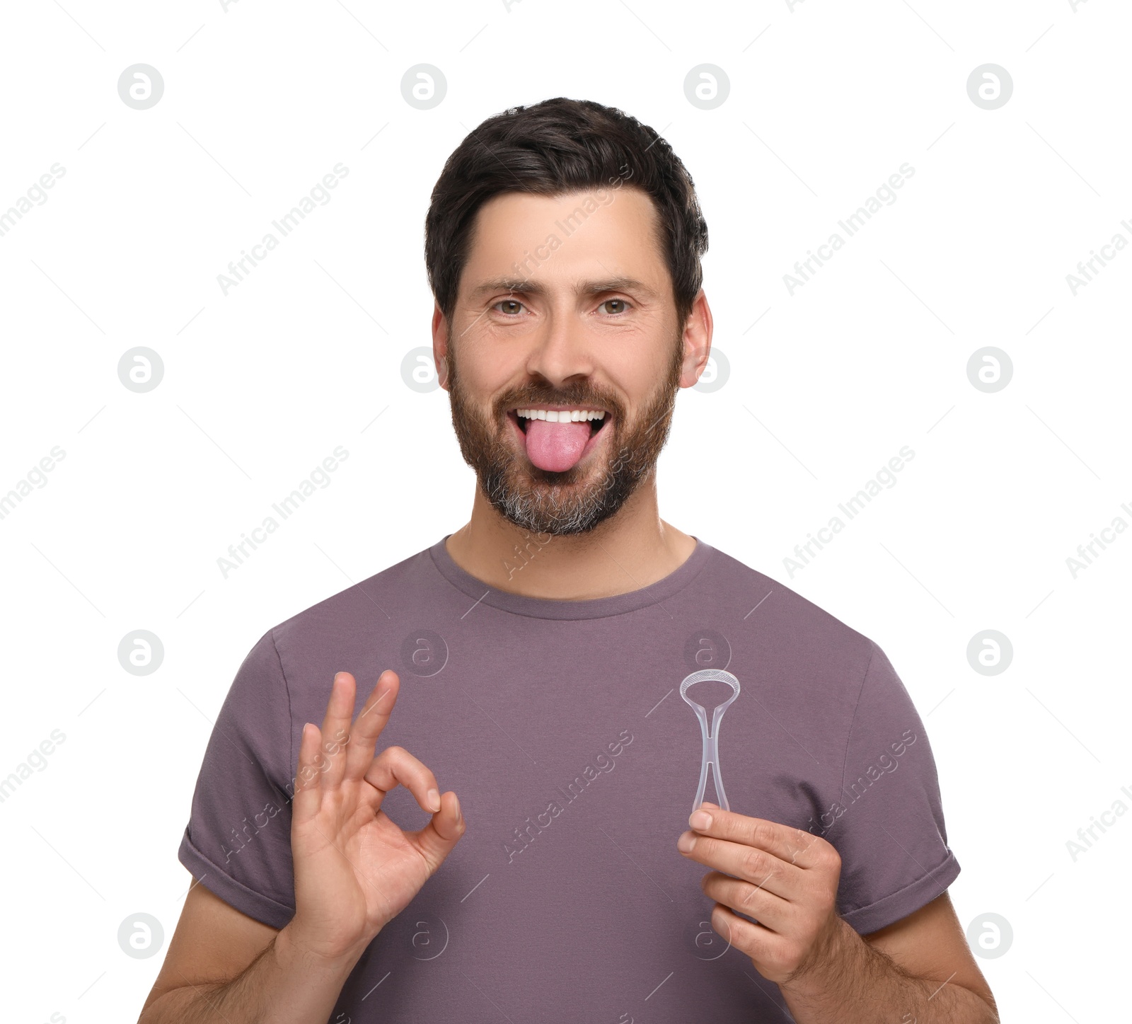 Photo of Happy man with tongue cleaner showing OK gesture on white background