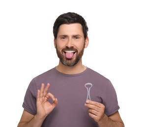 Photo of Happy man with tongue cleaner showing OK gesture on white background
