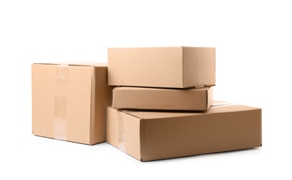 Photo of Pile of cardboard boxes on white background