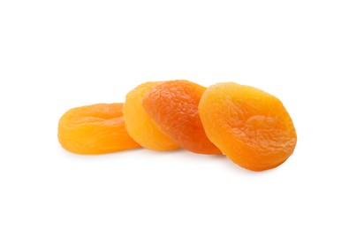 Photo of Tasty apricots on white background. Dried fruits