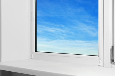 Photo of Window with empty white sill, closeup view