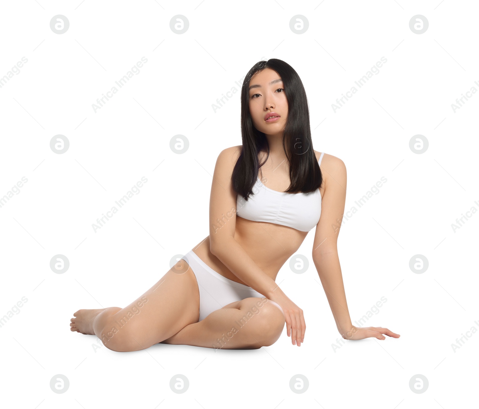 Photo of Beautiful young Asian woman with perfect smooth skin on white background. Beauty and body care