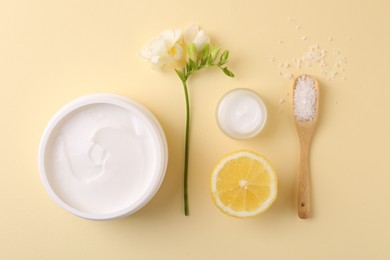 Flat lay composition with jars of cream on beige background. Body care product