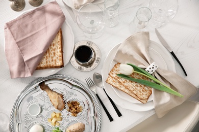 Photo of Festive Passover table setting, top view. Pesach celebration