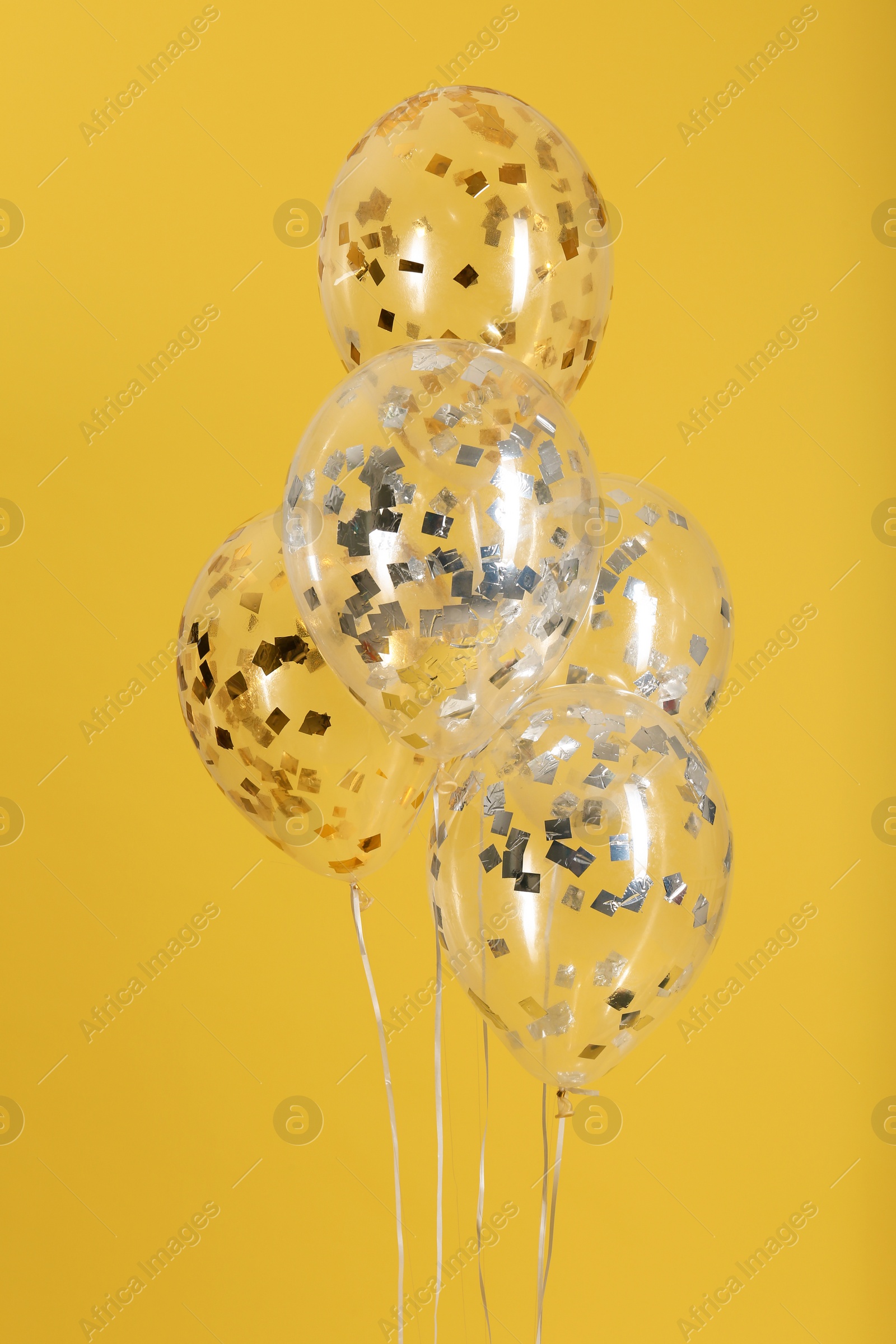 Photo of Bunch of bright balloons on color background