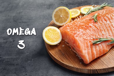 Image of Omega 3. Piece of fresh salmon with salt, rosemary and lemon on grey table, closeup