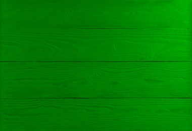 Image of St. Patrick day. Green wooden surface as background