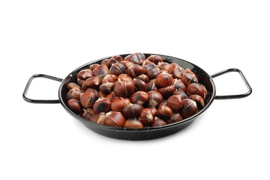 Photo of Delicious roasted edible chestnuts in wok frying pan isolated on white