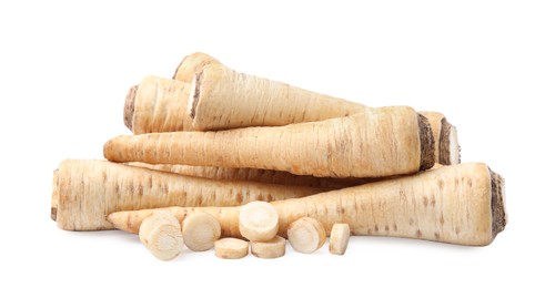 Photo of Raw parsley roots isolated on white. Healthy food