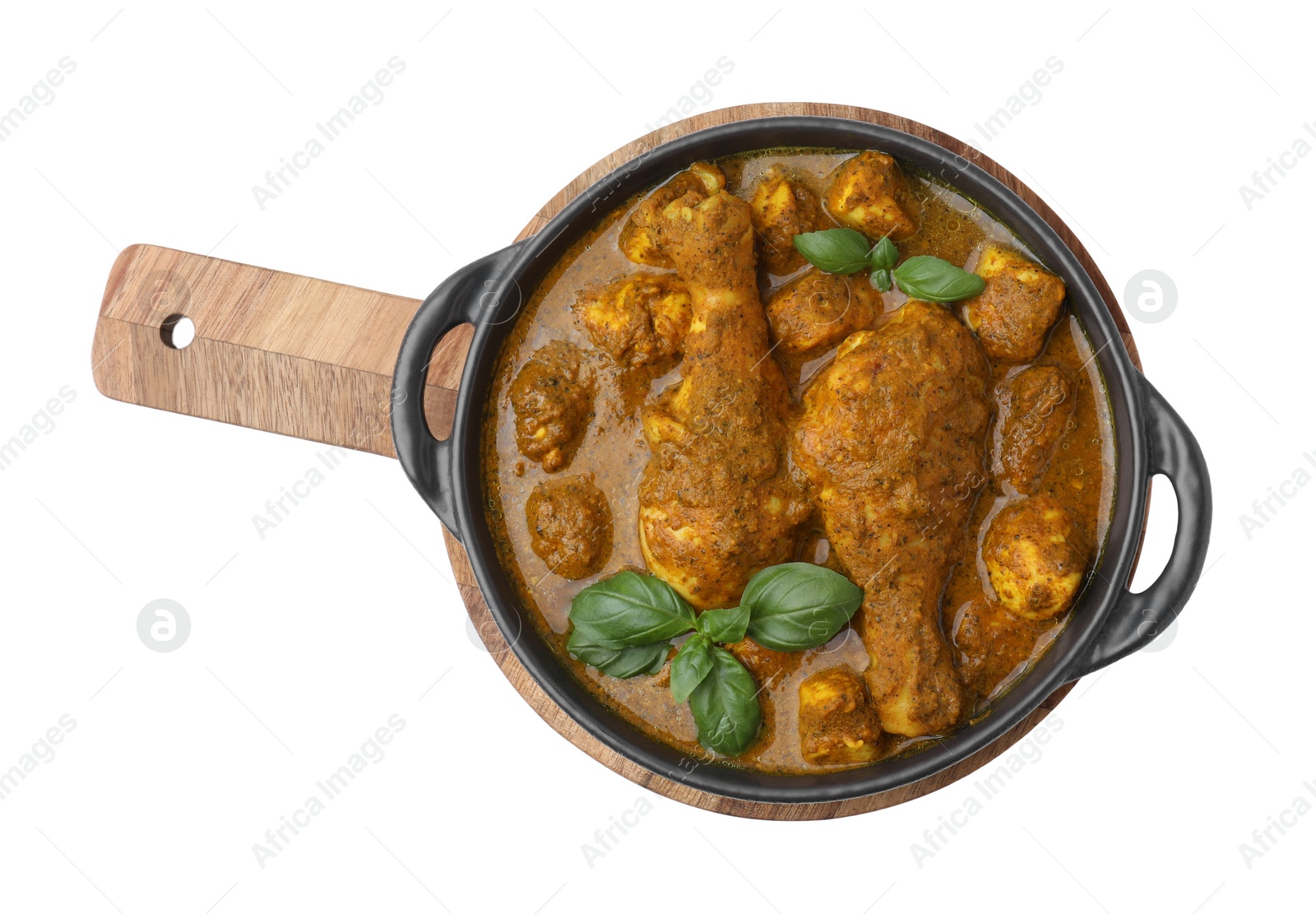 Photo of Delicious chicken with curry sauce and basil isolated on white, top view