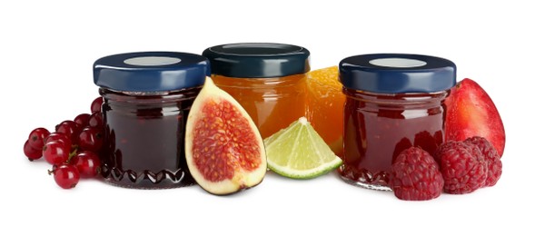 Photo of Jars of sweet jams and fresh ingredients on white background