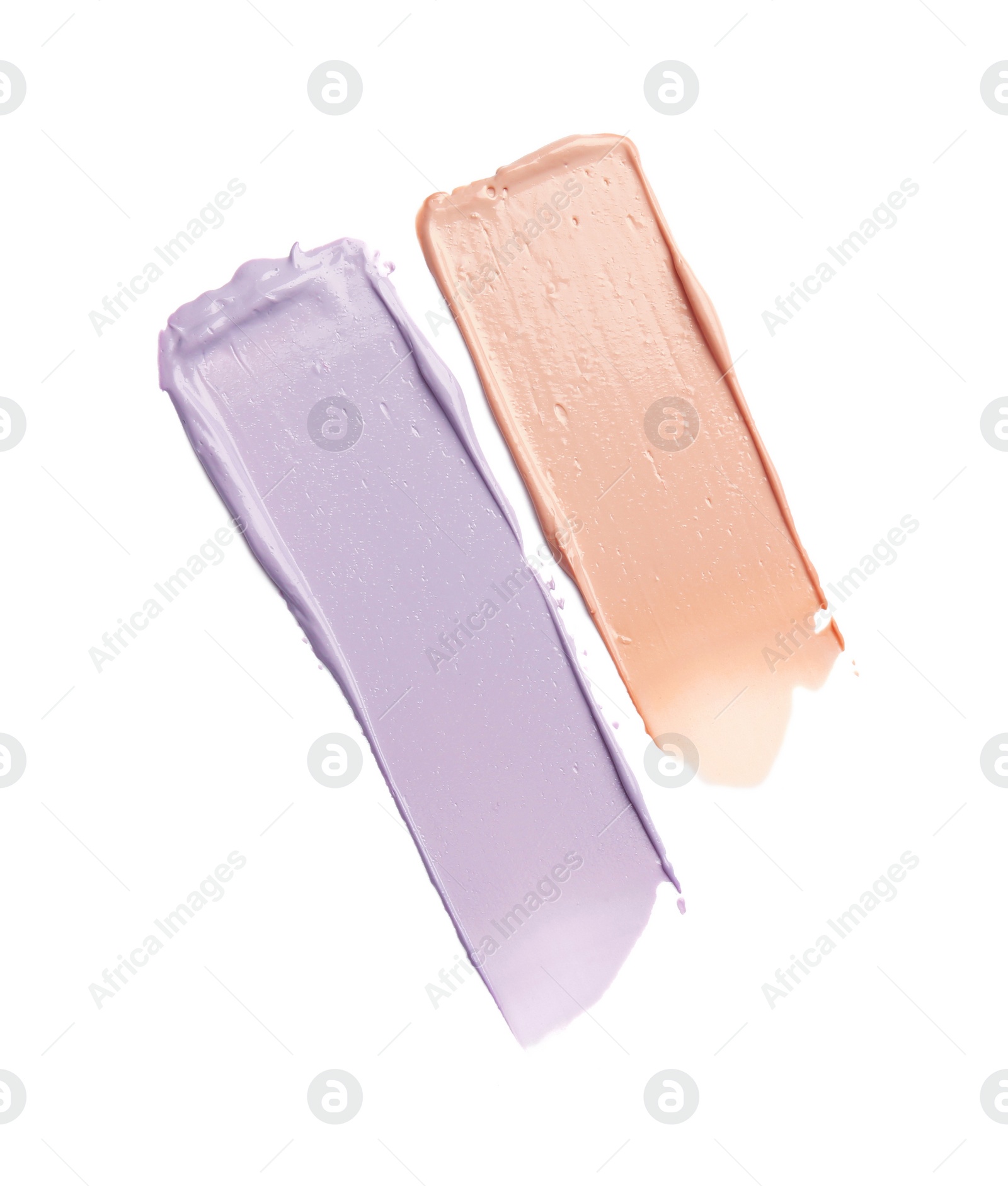 Photo of Strokes of pink and purple color correcting concealers on white background, top view