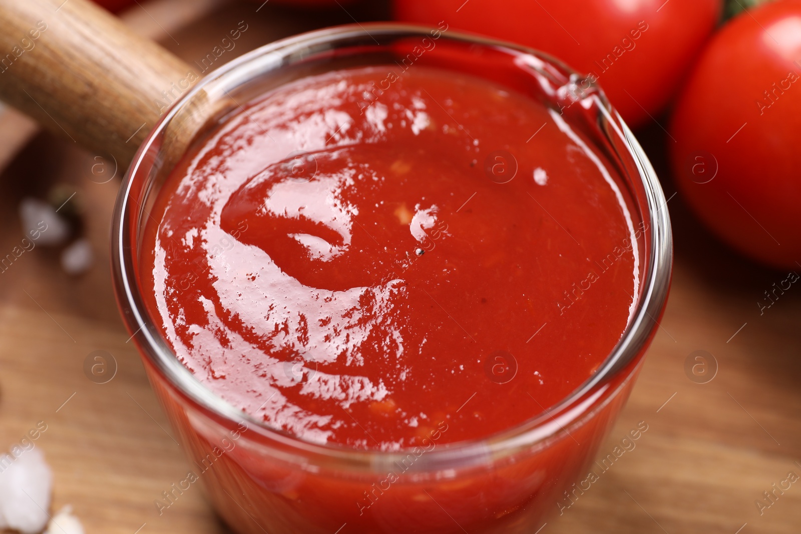 Photo of Delicious ketchup on table, closeup. Tomato sauce