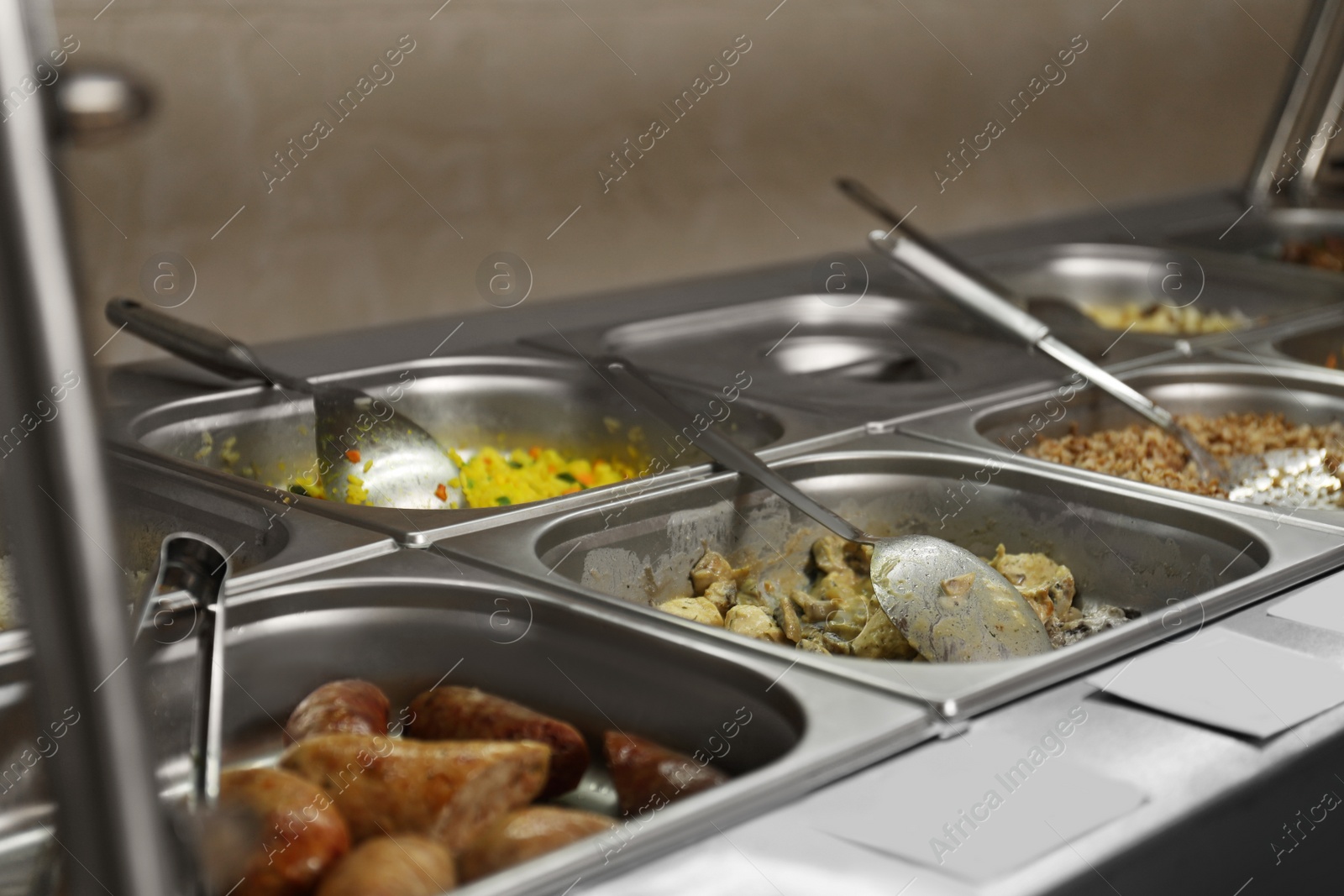 Photo of Containers with tasty food in school canteen