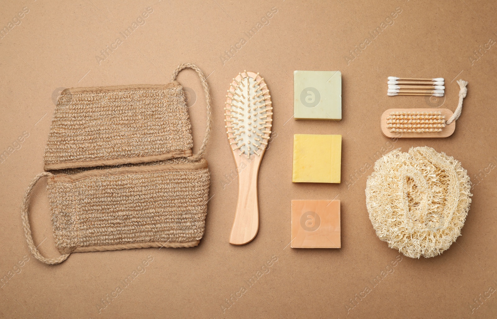 Photo of Eco friendly bathroom products on brown background, flat lay