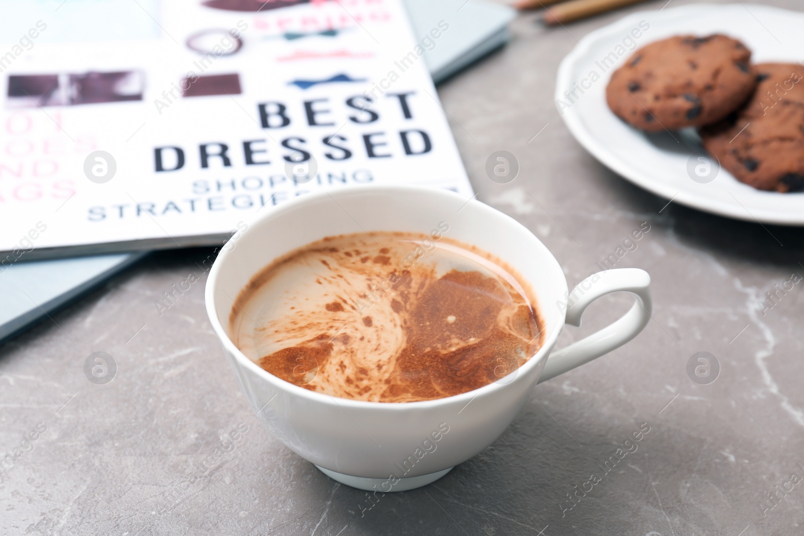 Photo of Cup of delicious hot coffee on table