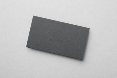 Blank black business card on light background, top view. Mockup for design