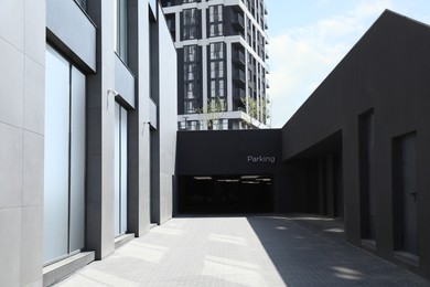 Photo of Parking garage with metal gate in modern building