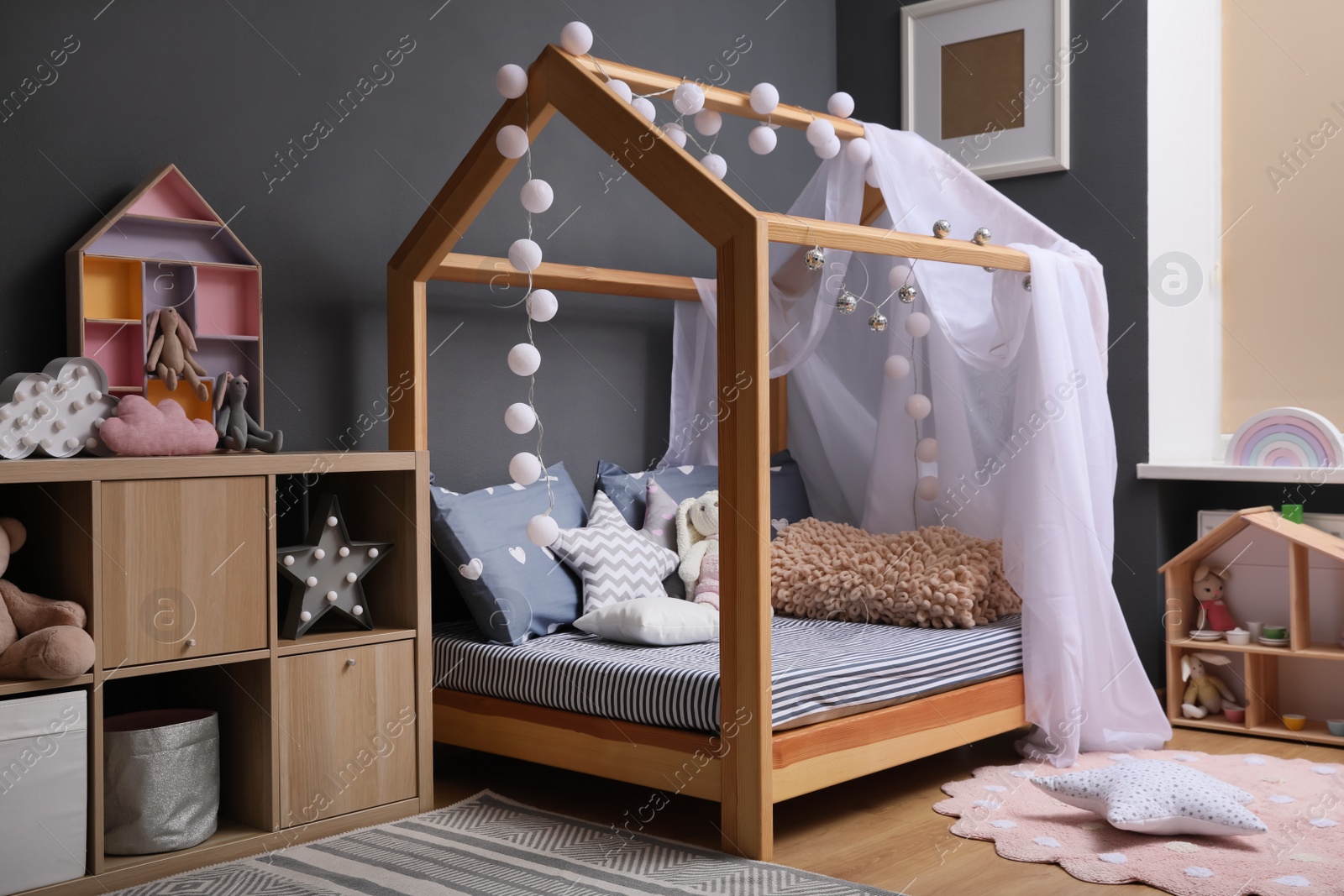 Photo of Stylish child room interior with comfortable bed