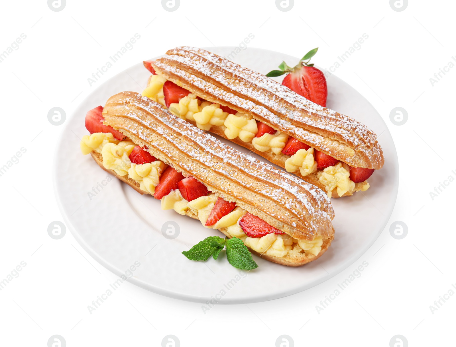 Photo of Delicious eclairs filled with cream, strawberries and mint isolated on white