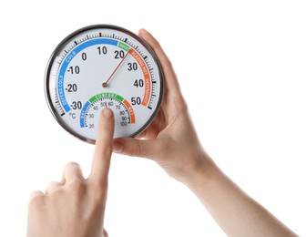 Photo of Woman holding dial hygrometer on white background, closeup