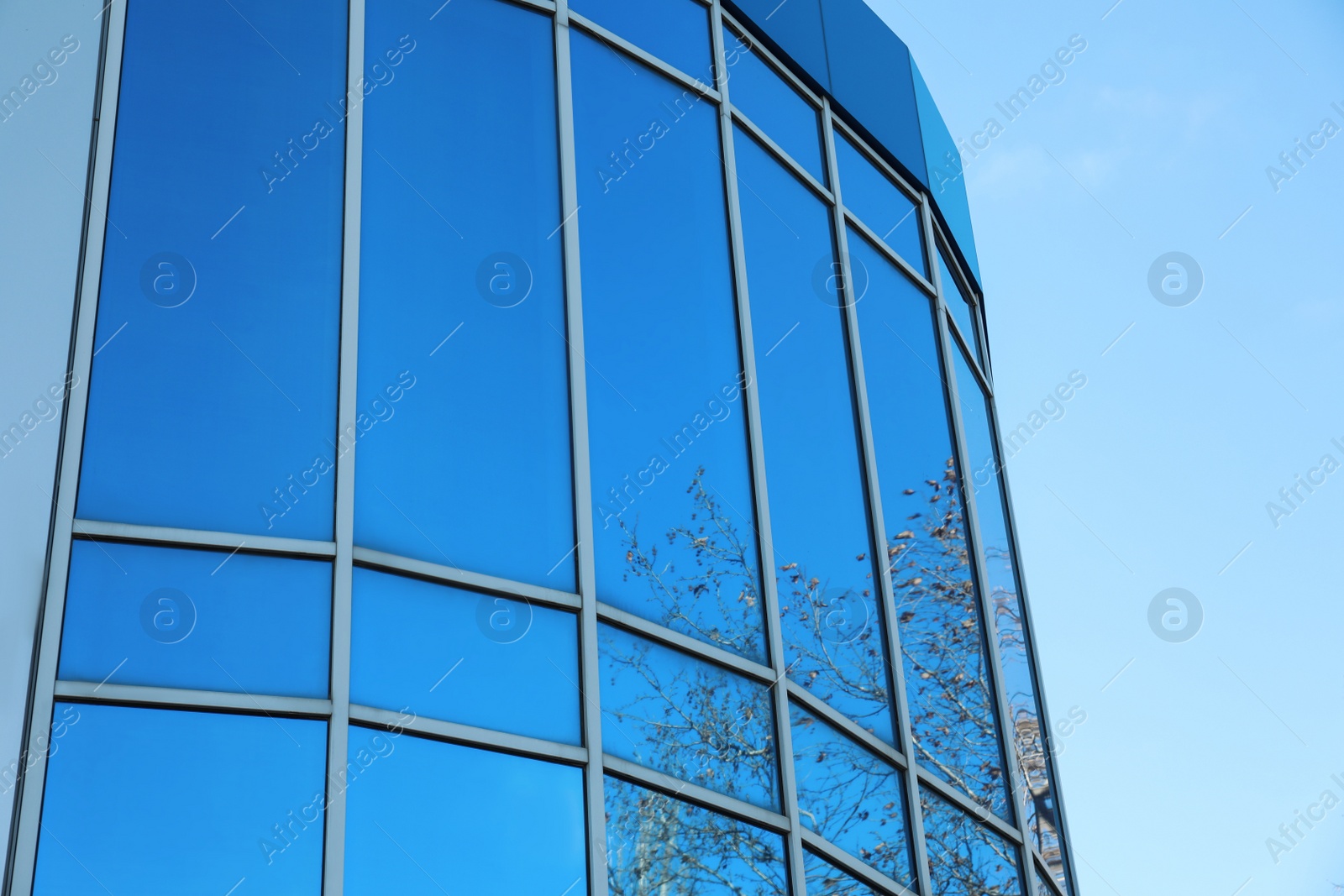 Photo of New modern building with tinted windows outdoors