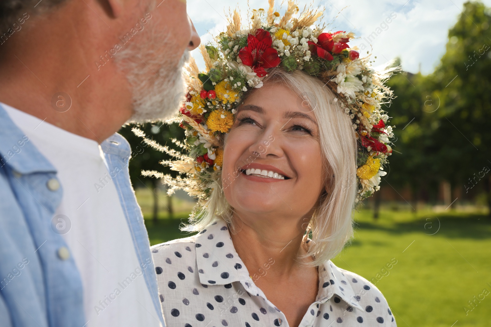 Photo of Lovely mature couple spending time together in park