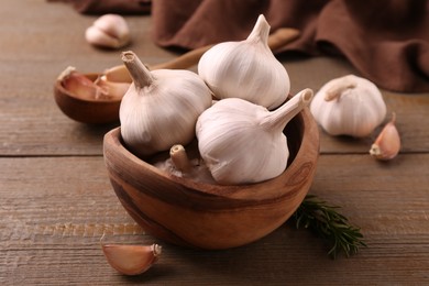 Fresh garlic on wooden table, closeup view