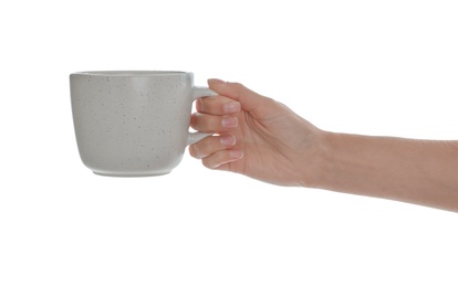 Photo of Woman holding elegant ceramic cup on white background, closeup