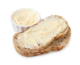 Photo of Slices of bread with tasty butter on white background