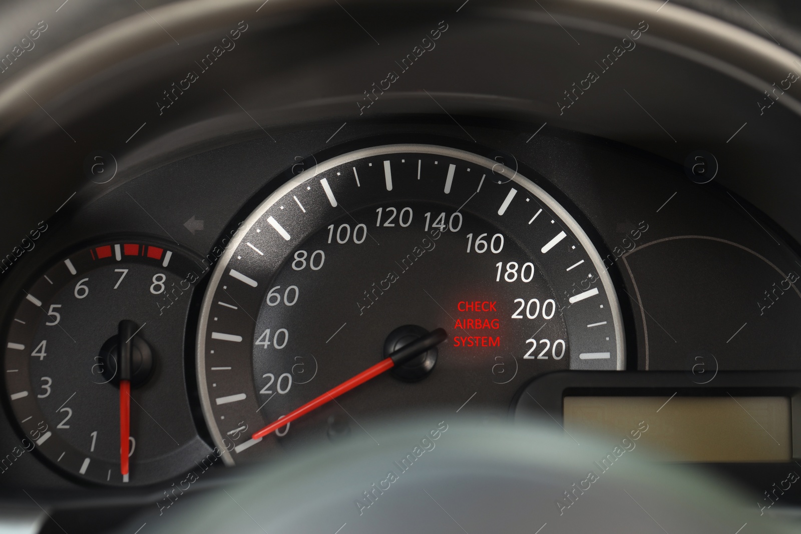 Image of Closeup view of dashboard with warning icon check airbag system in car