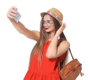 Attractive young woman taking selfie on white background