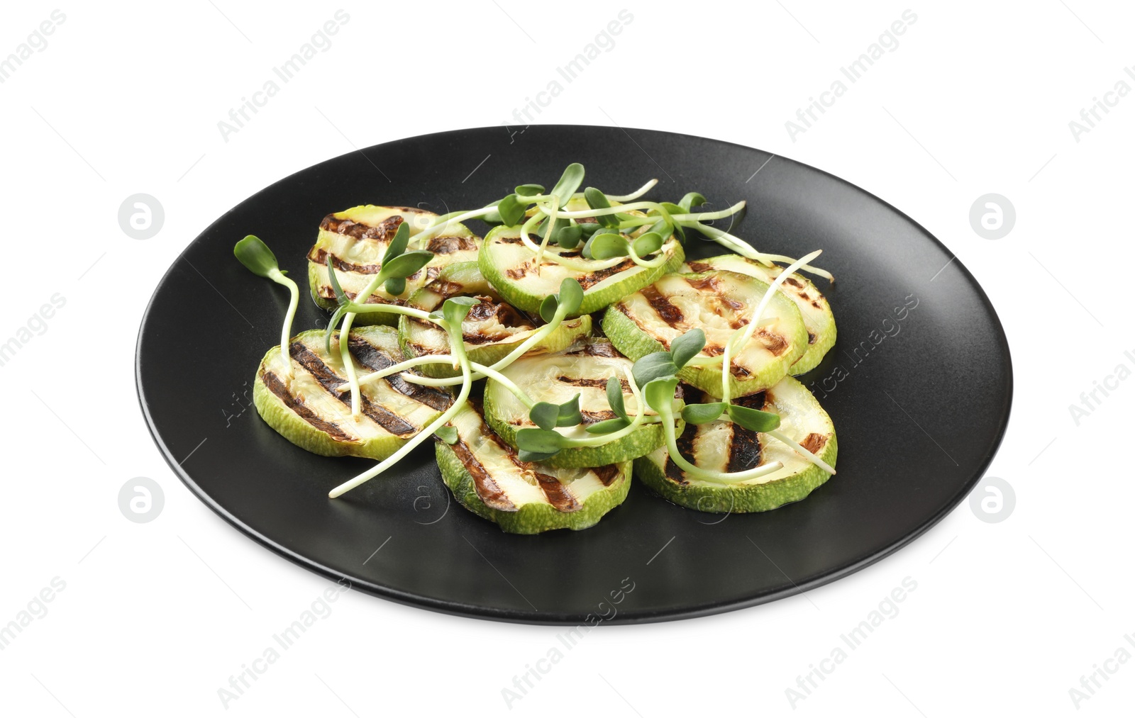 Photo of Delicious grilled zucchini slices and microgreens on white background