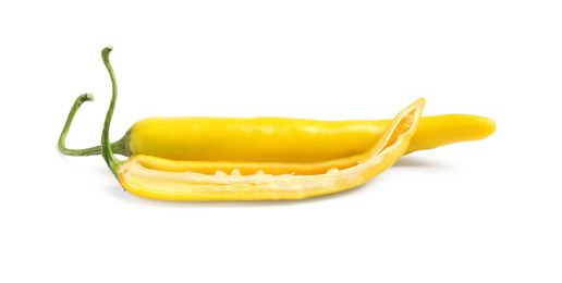 Photo of Cut and whole ripe yellow chili peppers isolated on white