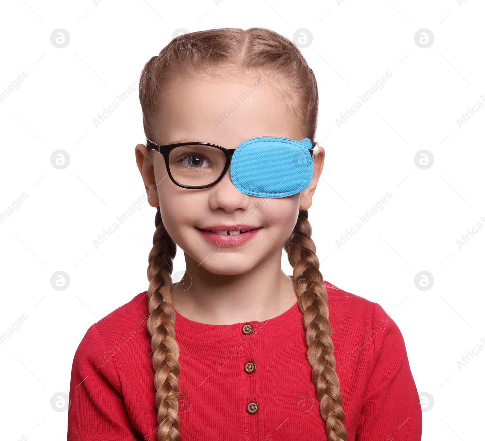 Photo of Happy girl with eye patch on glasses against white background. Strabismus treatment
