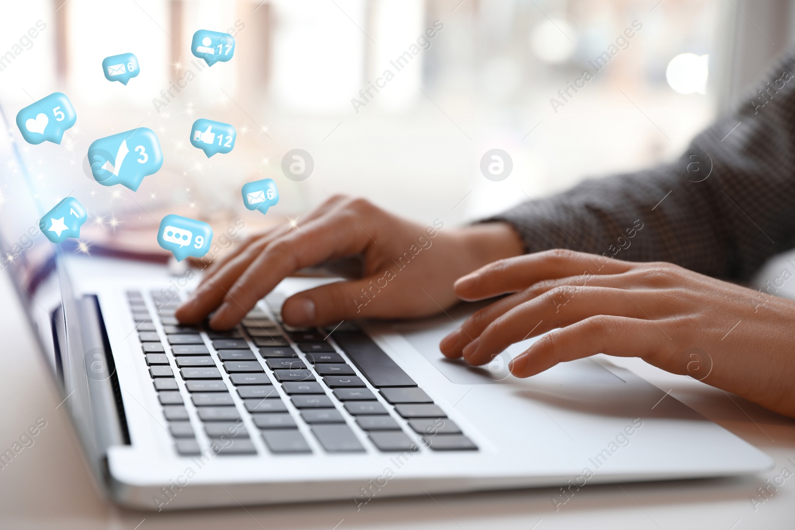 Image of Blogger working with laptop at table indoors, closeup. Social media marketing