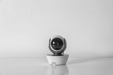 Modern CCTV security camera on white background