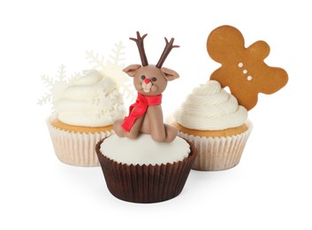 Photo of Different beautiful Christmas cupcakes on white background