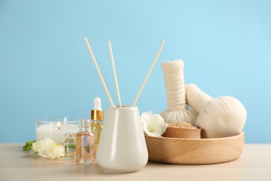 Beautiful composition with spa items on wooden table