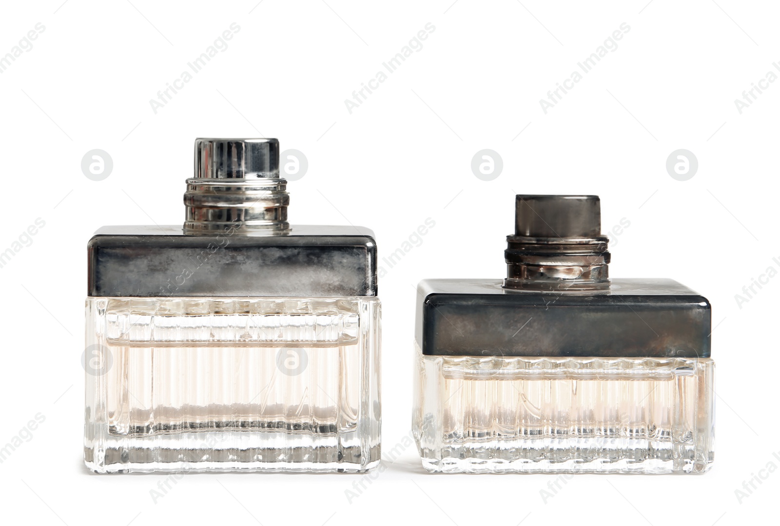 Photo of Different perfume bottles on white background